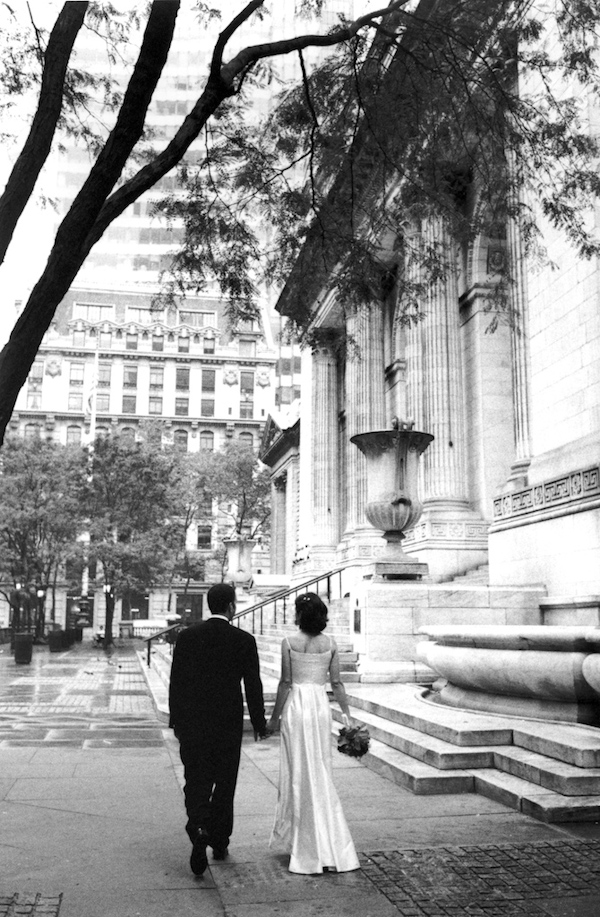 photo by New York City based wedding photographer Karen Hill - the happy couple walking in urban location